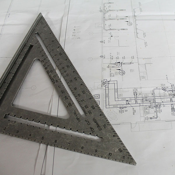 Drawing triangle on building plan | General liability insurance with NW Assekuranz
